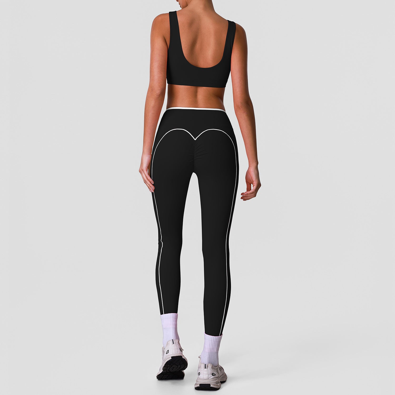 Sleeveless yoga set with high-waisted cross-over color-blocked yoga leggings