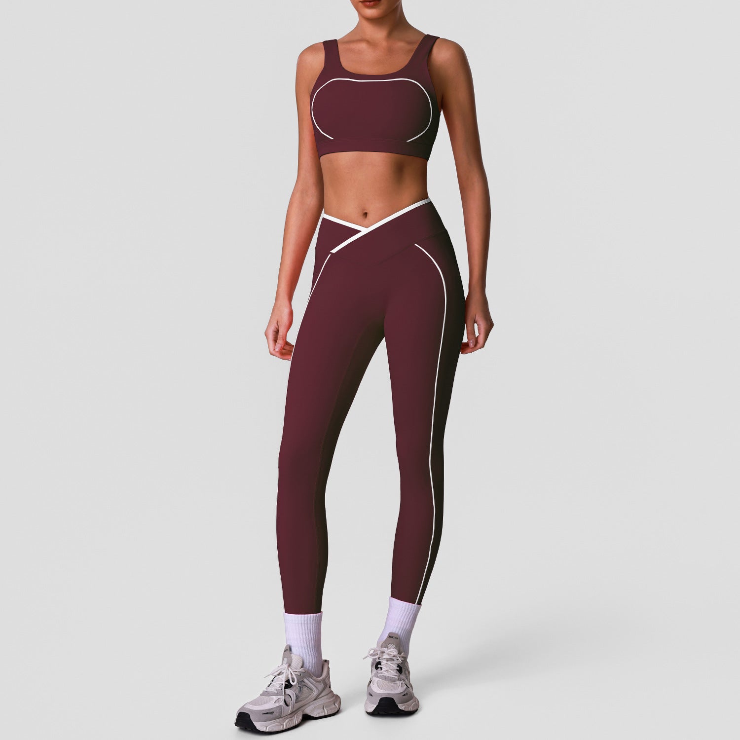 Sleeveless yoga set with high-waisted cross-over color-blocked yoga leggings