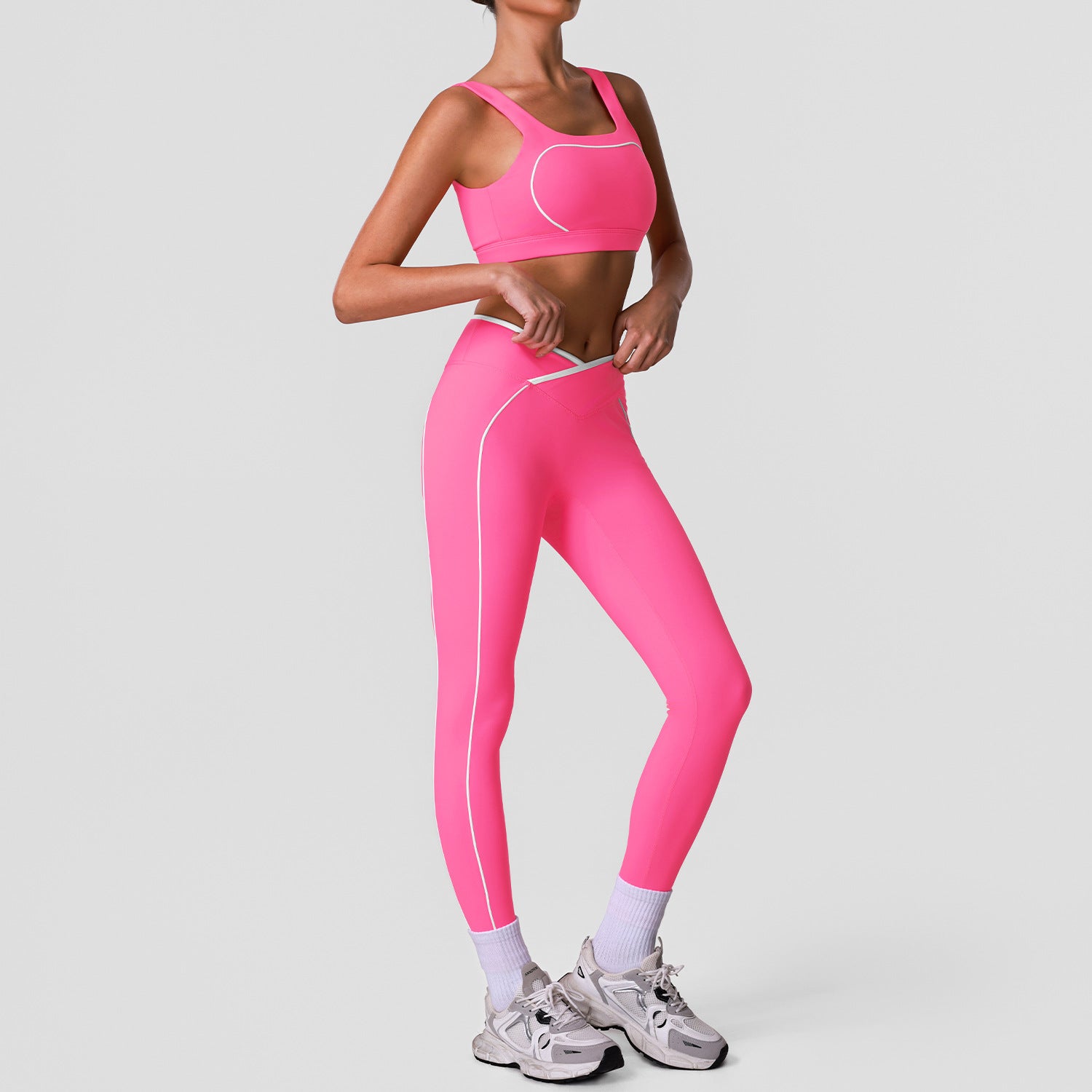 Sleeveless yoga set with high-waisted cross-over color-blocked yoga leggings